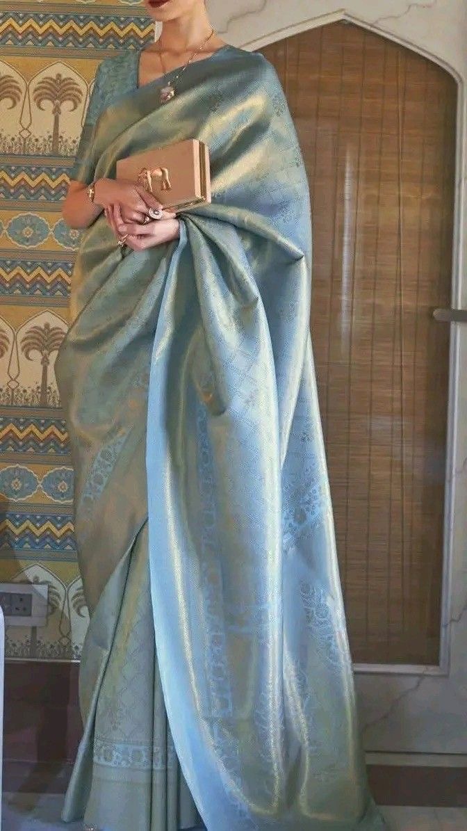 Soft blue Banarasi silk saree with gold motifs